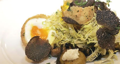 Silver Oak Cellars winery chef Dominic Orsini prepared this frisée salad of black truffles, local foraged mushrooms, egg croquette and crispy potatoes for a cooking demonstration taped at Tout Suite Social Club for the upcoming Napa Truffle Festival. J.L. Sousa/Register